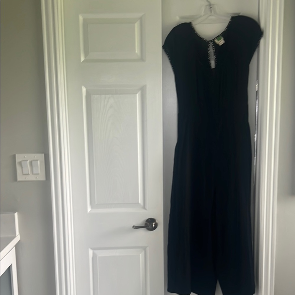 by Anthropologie black jumpsuit.